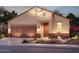 One-story home with brown garage doors and landscaping at 41930 W Hospitality Ln, Maricopa, AZ 85138