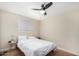 Simple bedroom with a double bed and ceiling fan at 4937 N Granite Reef Rd, Scottsdale, AZ 85251