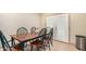 Dining area with wooden table and chairs near kitchen at 4937 N Granite Reef Rd, Scottsdale, AZ 85251