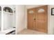 Entryway with wood-toned doors and built-in storage at 4937 N Granite Reef Rd, Scottsdale, AZ 85251