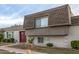Gray exterior condo with brown double doors and landscaping at 4937 N Granite Reef Rd, Scottsdale, AZ 85251