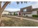 Condo complex featuring a gray building with brown doors and green landscaping at 4937 N Granite Reef Rd, Scottsdale, AZ 85251