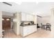 Bright kitchen features white cabinets, granite countertops, and a breakfast nook at 4937 N Granite Reef Rd, Scottsdale, AZ 85251