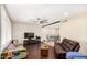Open living area with brick accent wall, dark wood floors, and seating at 4937 N Granite Reef Rd, Scottsdale, AZ 85251