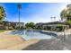 Community pool with lounge chairs and palm trees at 4937 N Granite Reef Rd, Scottsdale, AZ 85251