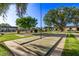 Community shuffleboard courts nestled amongst mature trees at 4937 N Granite Reef Rd, Scottsdale, AZ 85251