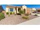 Front yard view of a single-story house with a two-car garage and desert landscaping at 7266 W Meadowlark Way, Florence, AZ 85132