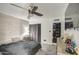 Bedroom with a bed, ceiling fan, and closet with shuttered doors at 7813 E Cypress St, Scottsdale, AZ 85257