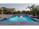 Sparkling pool with tiled surround and ample patio space at 8338 N 180Th Dr, Waddell, AZ 85355