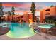 Resort-style pool and spa with waterfall features, surrounded by lush landscaping at 12222 N Paradise Village W Pkwy # 423, Phoenix, AZ 85032