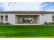 Covered patio with seating area, and grassy backyard at 1704 E Melrose St, Mesa, AZ 85203