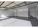 Spacious garage with open automatic door and epoxy flooring at 1704 E Melrose St, Mesa, AZ 85203