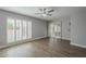 Bright bedroom with wood-look floors and sliding glass doors leading to a patio at 18548 E Parada Cir, Rio Verde, AZ 85263