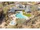 Community pool and spa, surrounded by lounge chairs and landscaping at 20801 N 90Th Pl # 263, Scottsdale, AZ 85255