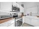 Modern kitchen with stainless steel appliances and wood countertops at 21617 N 30Th Ave, Phoenix, AZ 85027