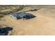 Aerial view showcasing the back of a new construction home with a patio at 22378 W Daley Ln, Surprise, AZ 85387