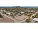 Aerial view of a property with a house, pool, and riding arena at 29224 N 146Th St, Scottsdale, AZ 85262