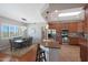 Modern kitchen with wood cabinets, granite countertops, and stainless steel appliances at 29224 N 146Th St, Scottsdale, AZ 85262