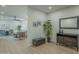 Elegant entryway with dark wood console table and two ottomans at 3144 S Joslyn --, Mesa, AZ 85212