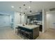 Modern kitchen with dark cabinetry, quartz countertops, and stainless steel appliances at 3144 S Joslyn --, Mesa, AZ 85212