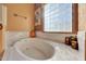 Relaxing bathroom with soaking tub and decorative accents at 31515 N 160Th St, Scottsdale, AZ 85262