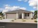 Single-story home with a two-car garage and neutral exterior finishes at 4337 E Bradford Ave, San Tan Valley, AZ 85140