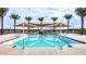 Community pool with a playground and shade structures nearby at 4337 E Bradford Ave, San Tan Valley, AZ 85140