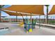 Community spray park with shaded play area next to pool at 4337 E Bradford Ave, San Tan Valley, AZ 85140