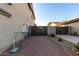 Side yard with gravel, gate, and utility access at 5322 N Oro Vista Ct, Litchfield Park, AZ 85340