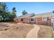 Charming ranch-style home with a walkway leading to the entrance at 618 N Stapley Dr, Mesa, AZ 85203