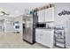 Well-equipped kitchen featuring stainless steel fridge and granite countertops at 618 N Stapley Dr, Mesa, AZ 85203