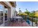 Private balcony with wrought iron railings, tile flooring, and outdoor seating overlooking the pool at 7500 E Mccormick Pkwy # 29, Scottsdale, AZ 85258