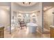 Large bathroom featuring a freestanding tub, walk-in shower, and arched windows at 7500 E Mccormick Pkwy # 29, Scottsdale, AZ 85258