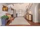 Elegant entryway with tiled floors, a grand staircase, and a sitting area at 7500 E Mccormick Pkwy # 29, Scottsdale, AZ 85258