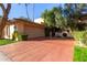 Spanish-style home with a large driveway and lush landscaping at 7500 E Mccormick Pkwy # 29, Scottsdale, AZ 85258