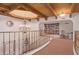 Upper hallway with a chandelier, built-in bookcase, and a curved staircase at 7500 E Mccormick Pkwy # 29, Scottsdale, AZ 85258