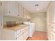 Laundry room with white cabinets, granite countertop, and washer/dryer hookups at 7500 E Mccormick Pkwy # 29, Scottsdale, AZ 85258