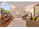 Living room featuring a fireplace and French doors opening to the backyard at 7500 E Mccormick Pkwy # 29, Scottsdale, AZ 85258