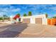 Three-car garage with a modern wooden gate at 8307 N Vía Rico --, Scottsdale, AZ 85258