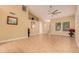 Bright living room featuring tile floors, vaulted ceilings and ceiling fan at 861 E Vaughn Ave, Gilbert, AZ 85234