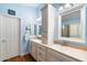 Updated bathroom with double vanity, good storage and light blue walls at 913 N John Way, Chandler, AZ 85225