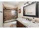 Clean bathroom, featuring a shower/tub combo and granite vanity at 9731 E Sutton Dr, Scottsdale, AZ 85260