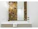 Stylish bathroom with a marble sink and floral wallpaper at 10101 E Happy Valley Rd # 6, Scottsdale, AZ 85255