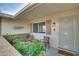 Inviting front patio with seating area and landscaping at 10401 W Desert Forest Cir, Sun City, AZ 85351