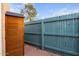 Outdoor patio area with wood storage shed and privacy fence at 1043 E Northern Ave, Phoenix, AZ 85020