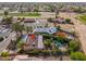 Aerial view showcasing the home's expansive layout, pool, and surrounding landscape at 14264 S Baniff Ln, Arizona City, AZ 85123