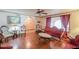 Living room with hardwood floors and antique furniture at 14264 S Baniff Ln, Arizona City, AZ 85123