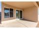 Covered patio with sliding glass doors at 15351 W Port Royale Ln, Surprise, AZ 85379