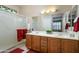 Double vanity bathroom with a large mirror and shower at 16933 W Oasis Springs Way, Surprise, AZ 85387
