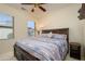 Guest bedroom with a queen-size bed and window at 16933 W Oasis Springs Way, Surprise, AZ 85387